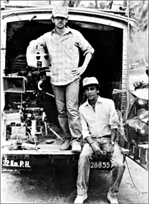 A movie director giving directions to his team on a film set.