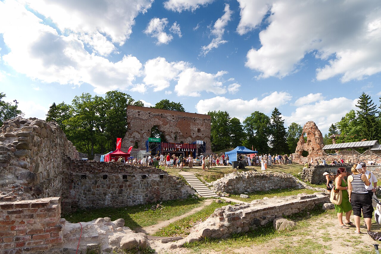 People enjoying music together at a big outdoor folk festival.