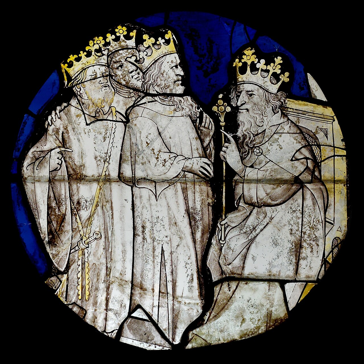 A colorful stained glass window showing three wise men in a story.