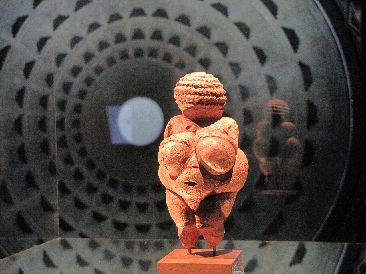 Tiny stone carving of a woman made thousands of years ago.