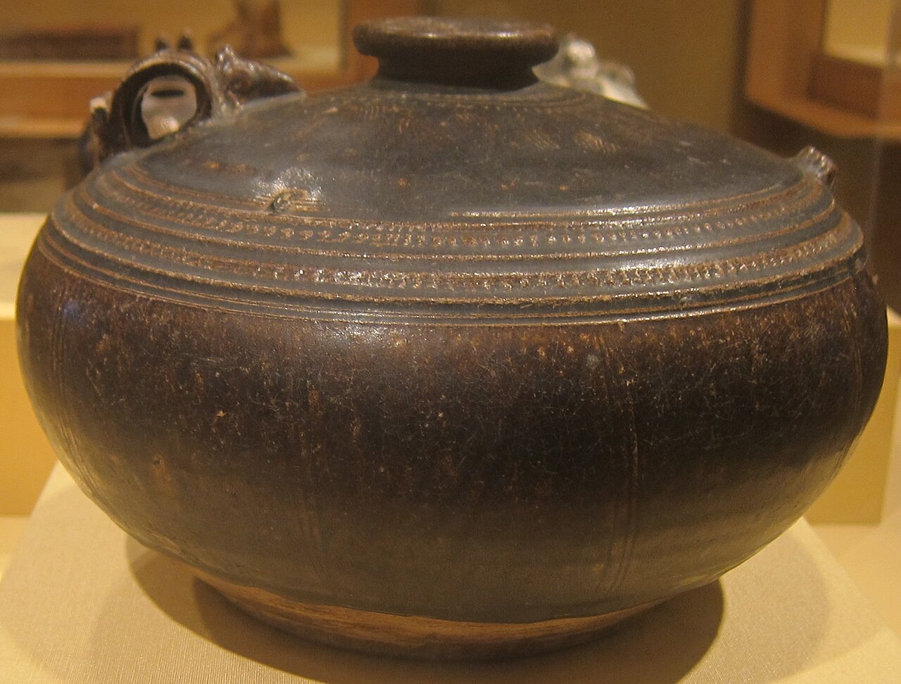 Beautiful old clay jar made in Cambodia long ago.