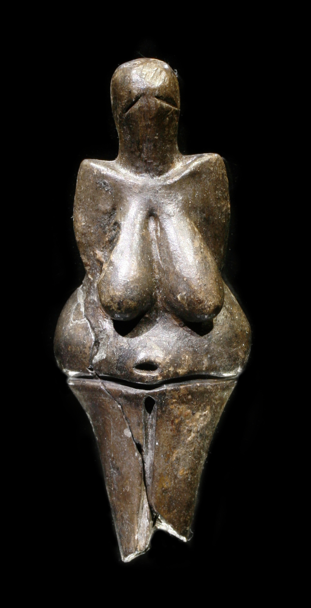 Tiny clay figure of a woman made in the Stone Age.