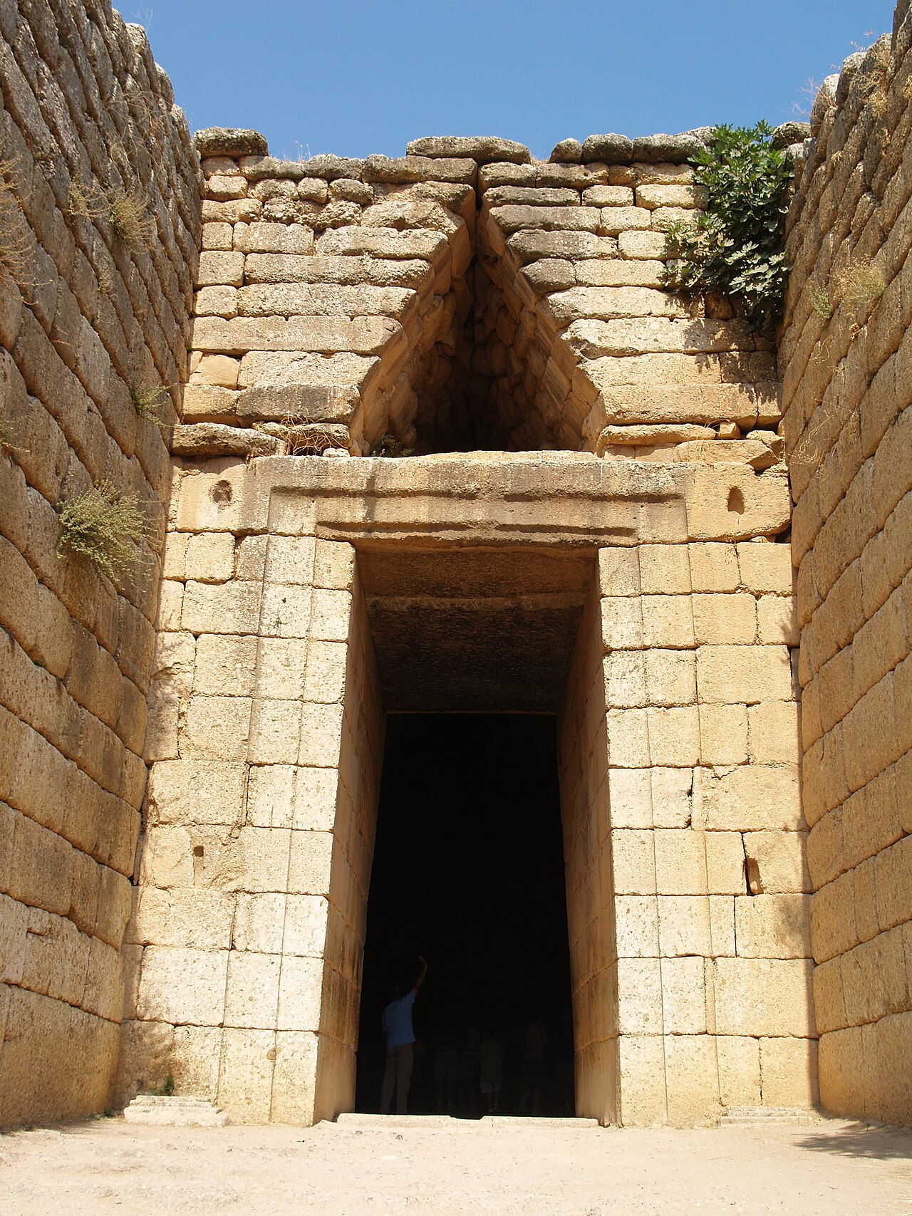 Stone archway leading into an ancient Greek tomb.