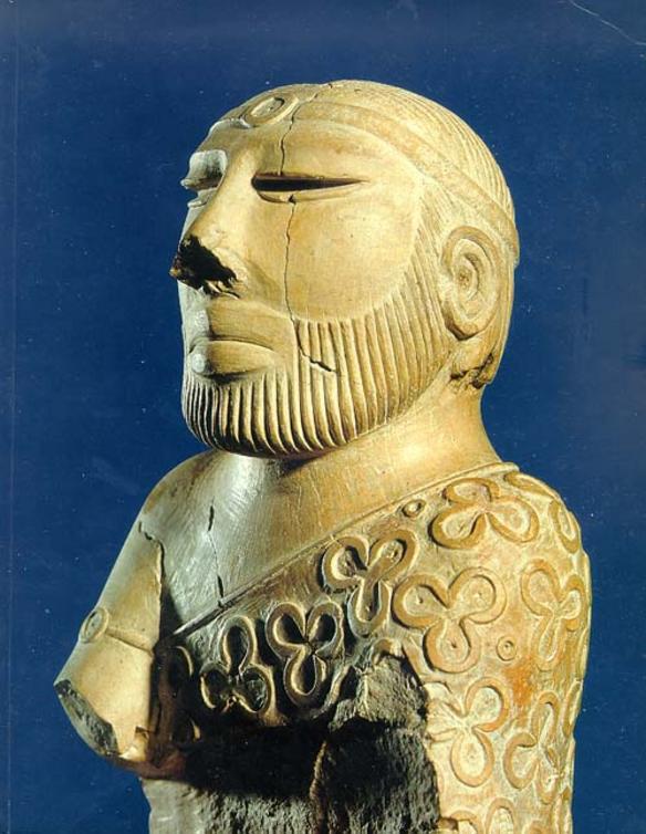 Carved stone head of an ancient priest or king.