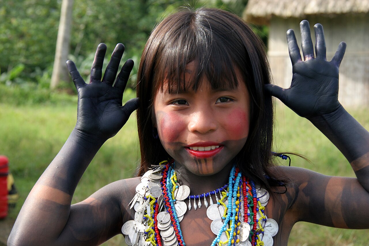 Young girl wearing a colorful outfit ready to dance.