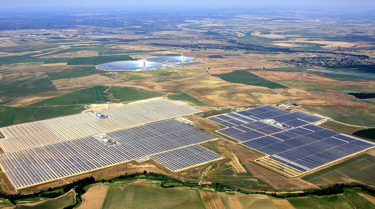 Huge rows of shiny mirrors catch sunlight to make electricity.