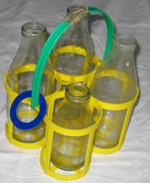 Glass milk bottles are washed and used again to save waste.
