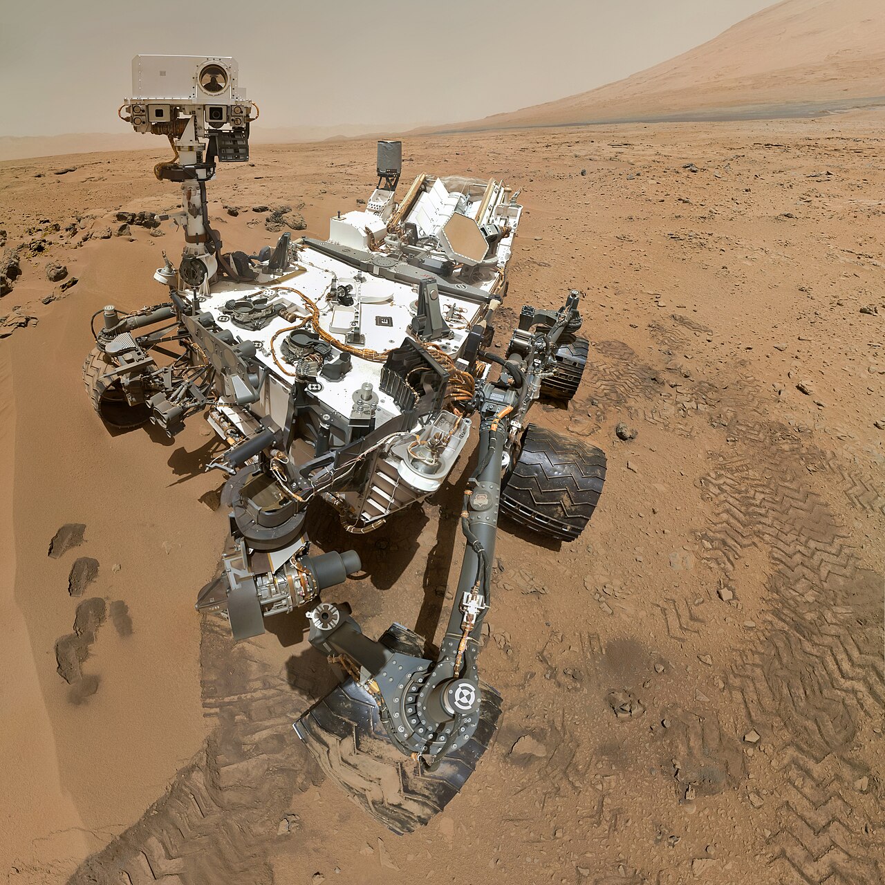 A Mars rover takes a selfie on the dusty red planet.