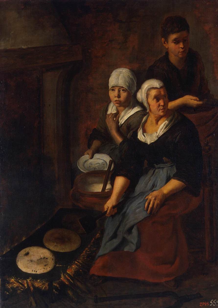 An old picture of people baking flat cakes long ago.