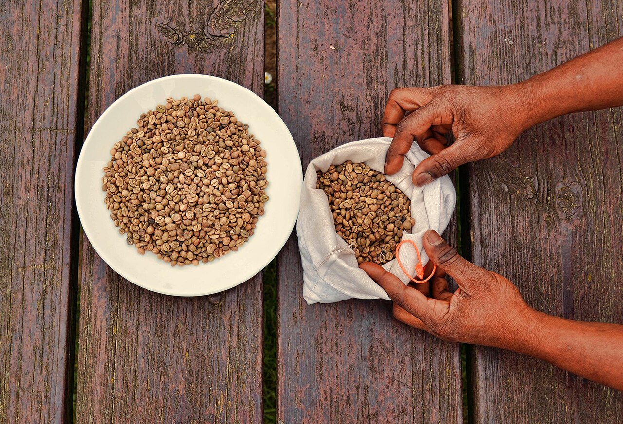A pile of brown, roasted coffee beans ready to be ground.
