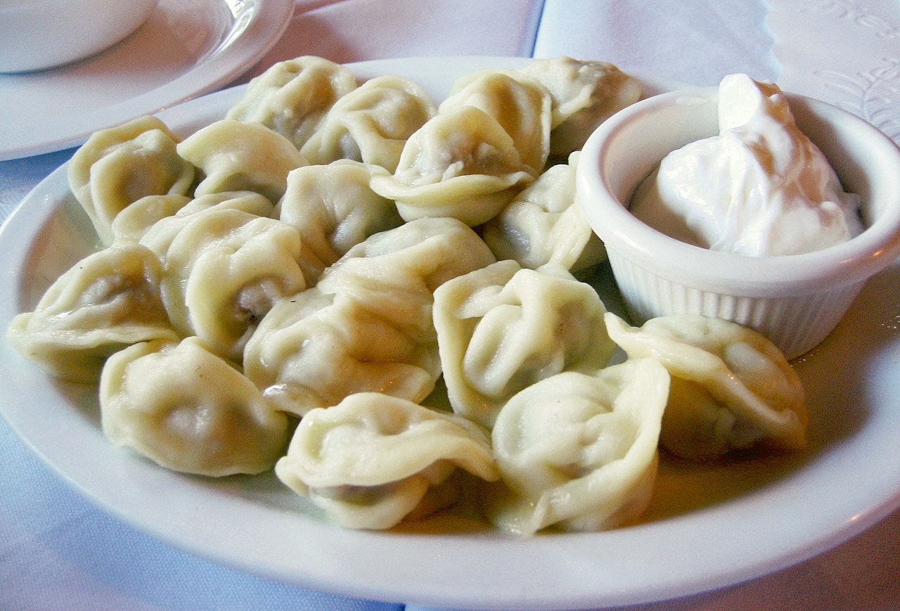 A plate of tasty dumplings ready to eat.