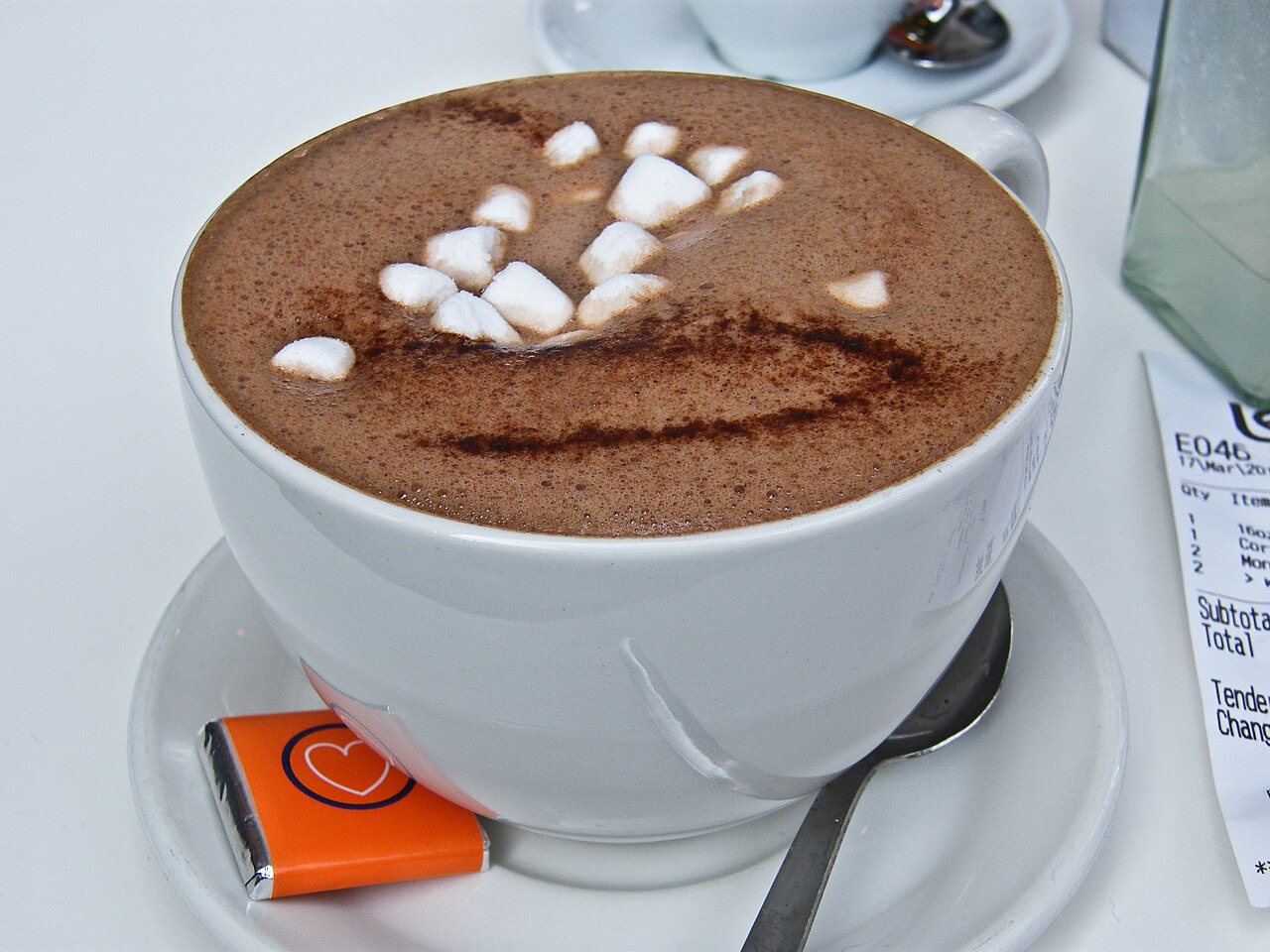 A warm cup of hot chocolate topped with fluffy marshmallows.