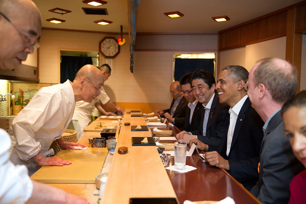 World leaders enjoying sushi made by a famous chef in Japan.
