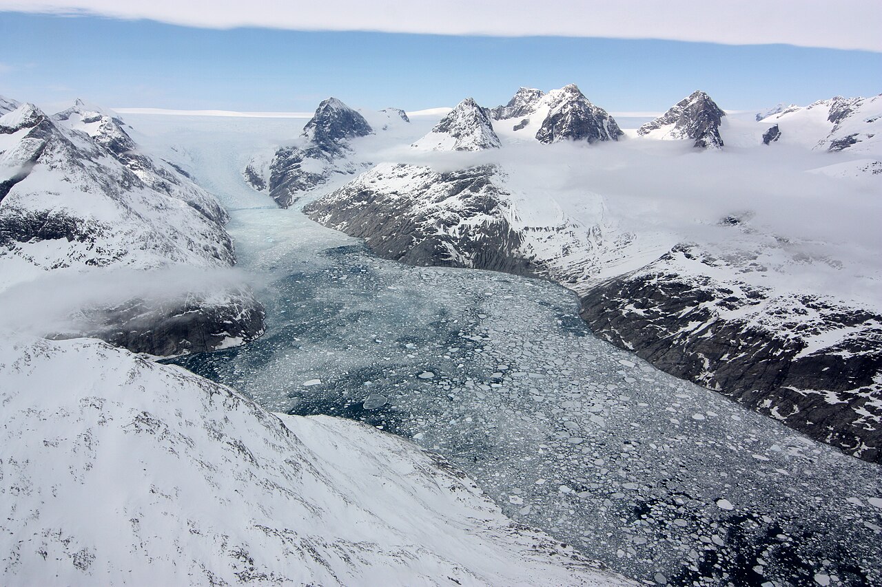 A slow glacier carves a deep fjord in Greenland.