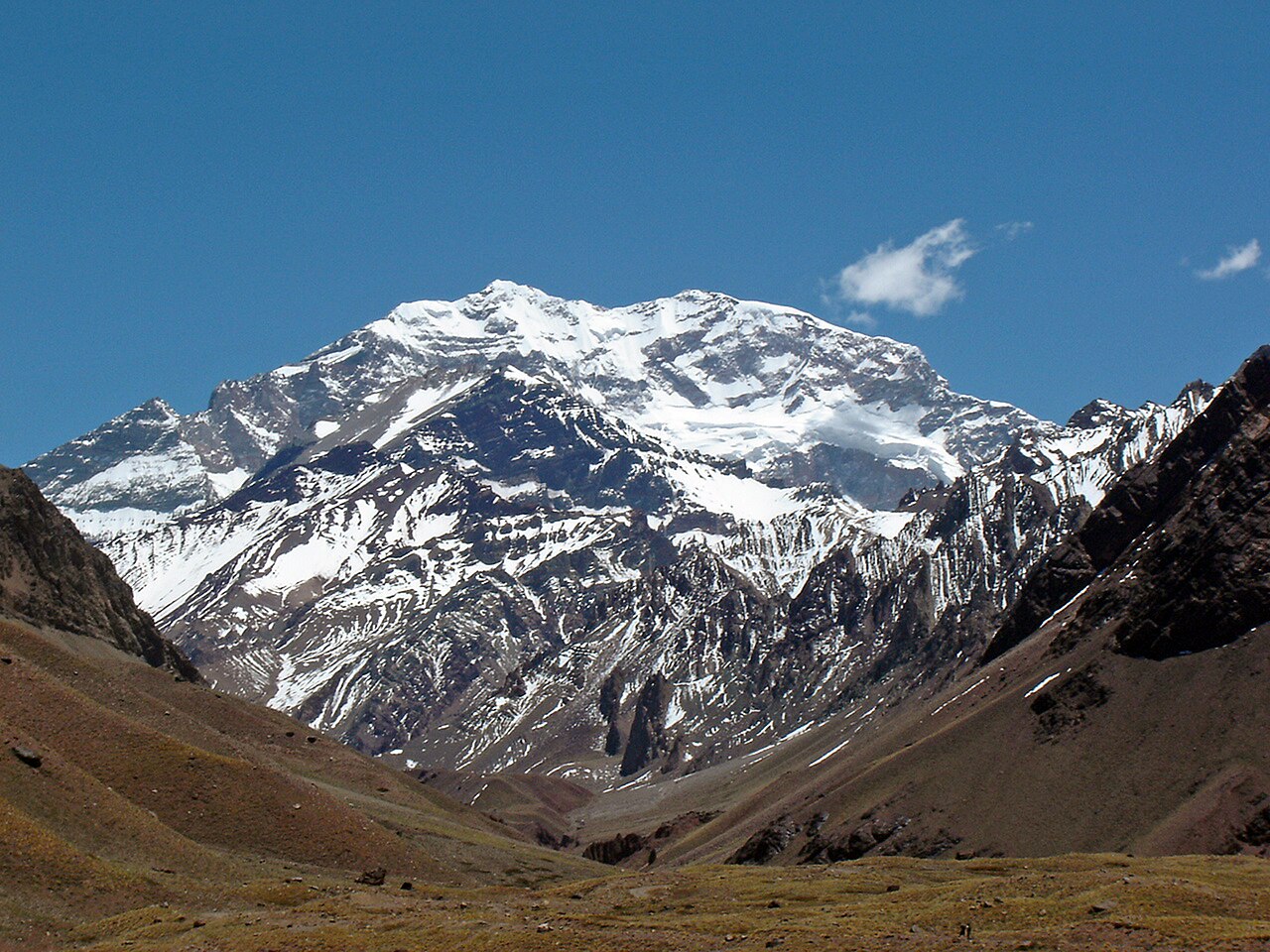 A tall, rocky peak rises above the Andes Mountains.