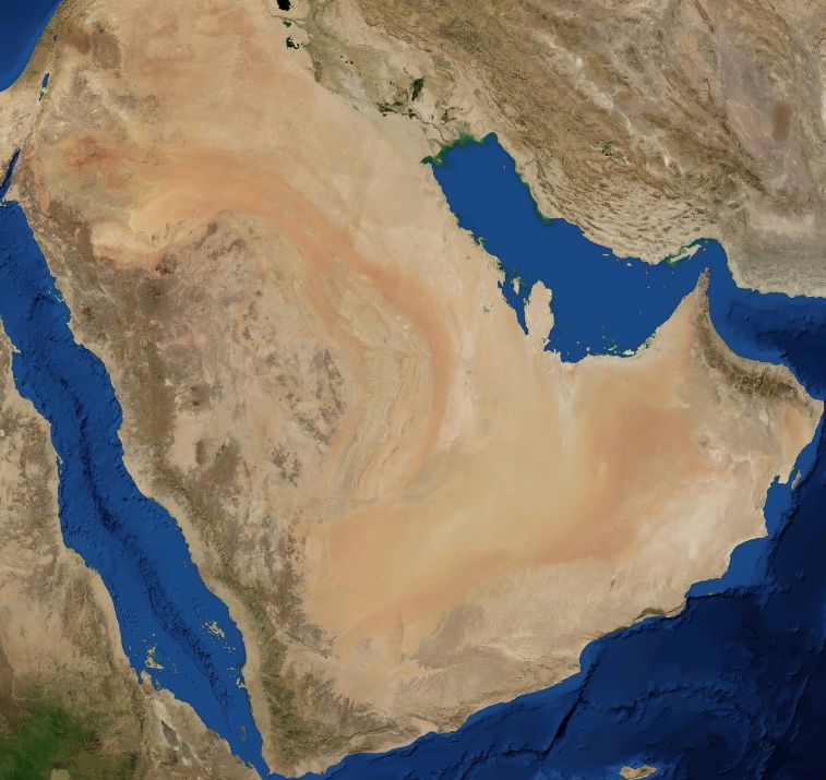 A space photo shows the vast sandy Arabian Desert.
