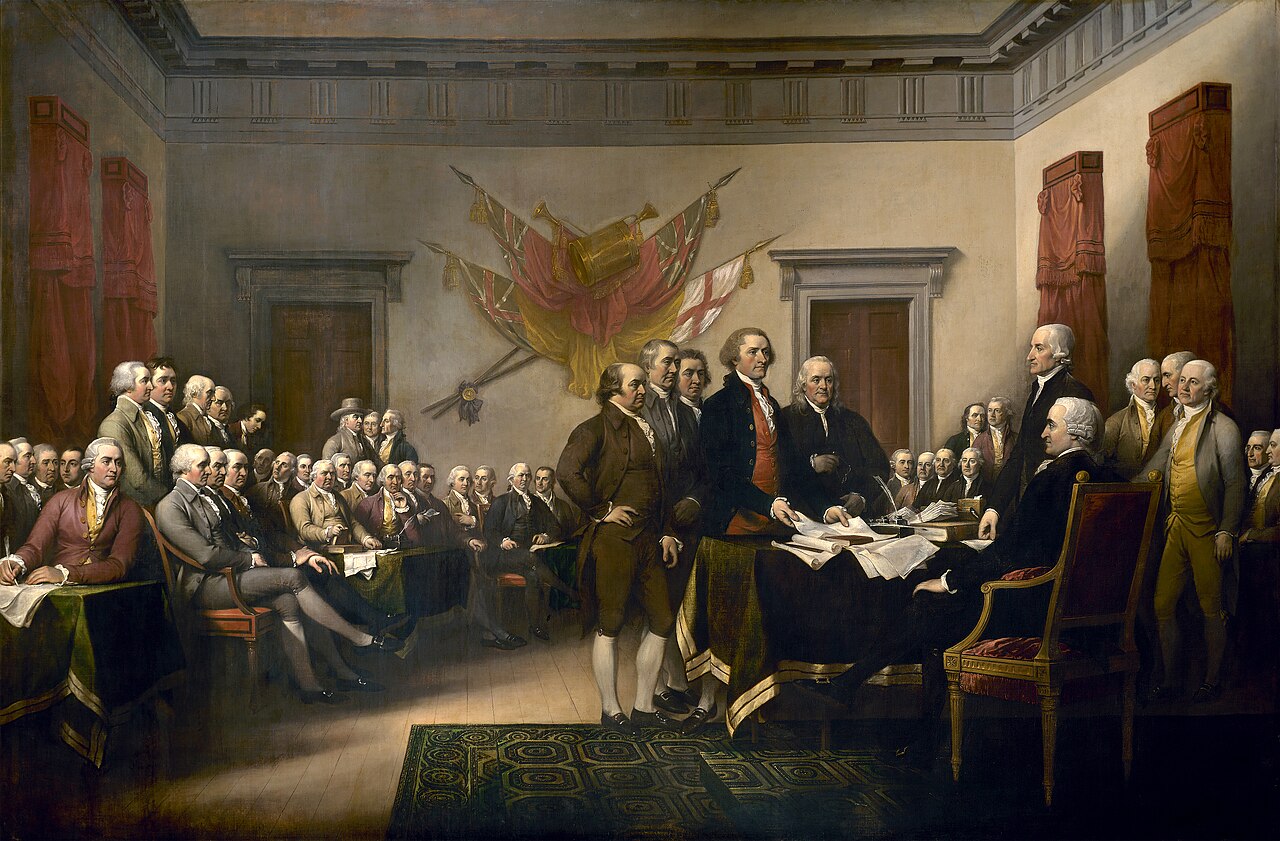 A painting showing American leaders sharing their new freedom document.