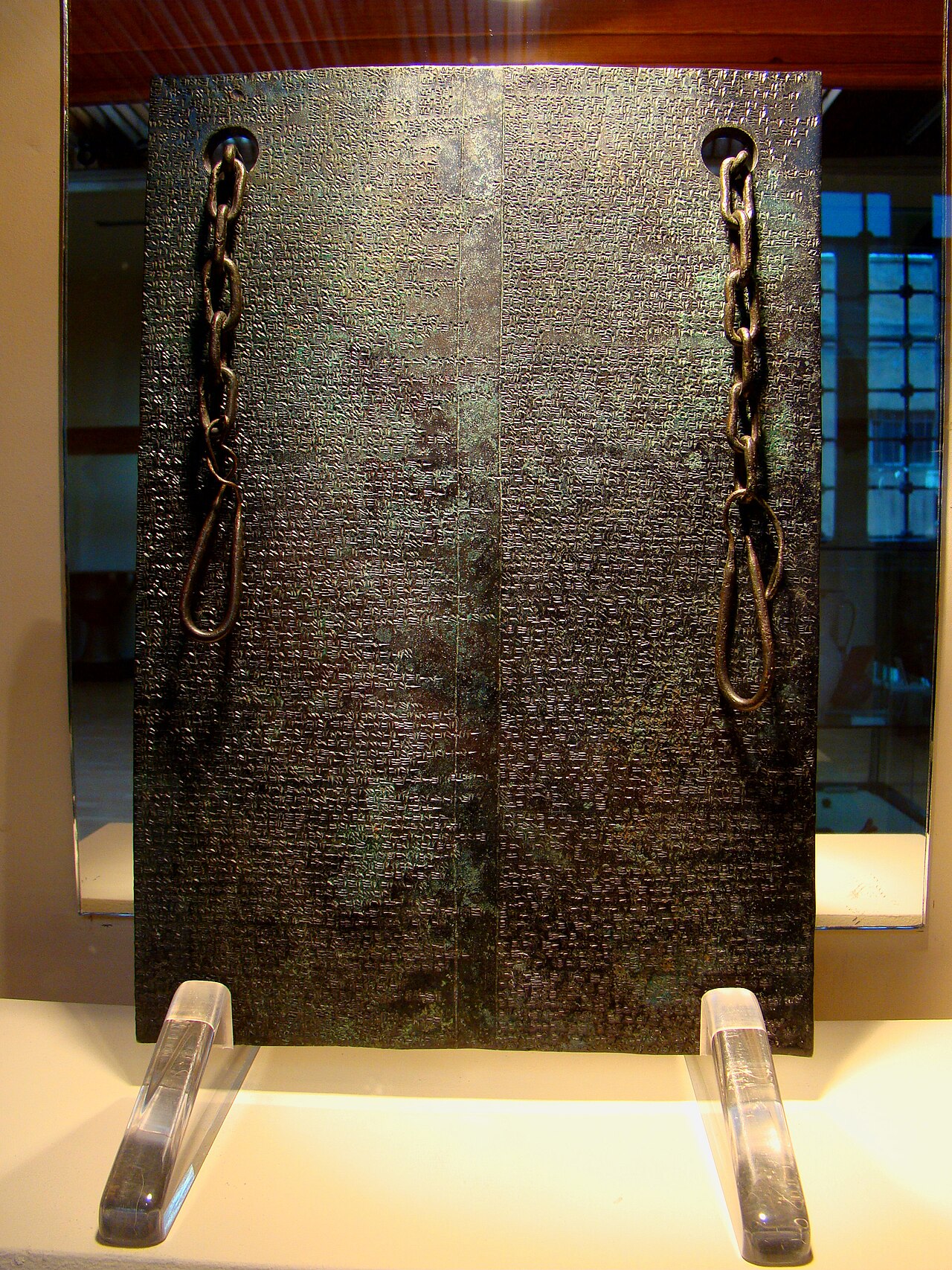 A bronze tablet with writing from the Bronze Age long ago.