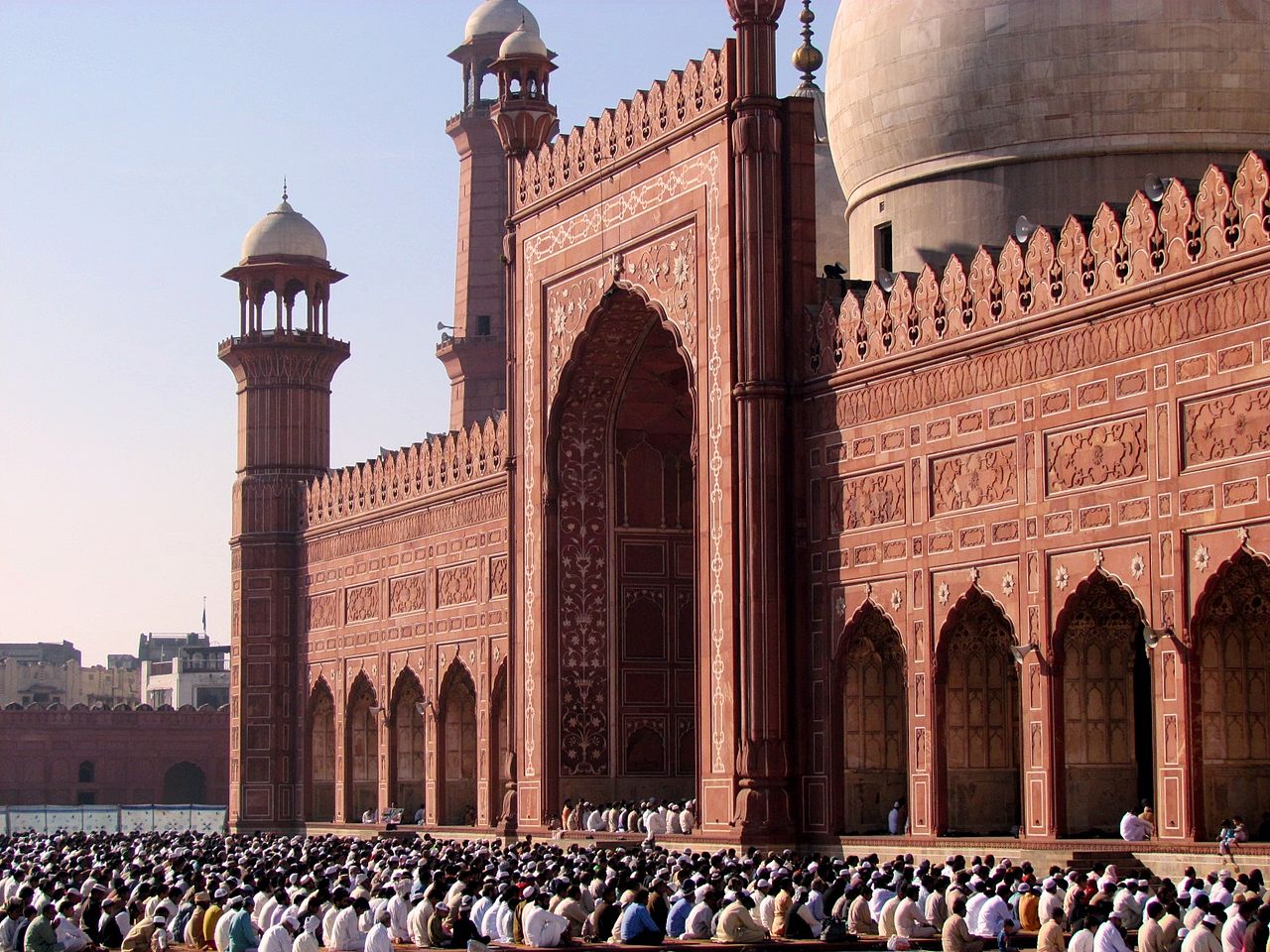 A tall, beautiful monument stands ready for an Eid celebration.