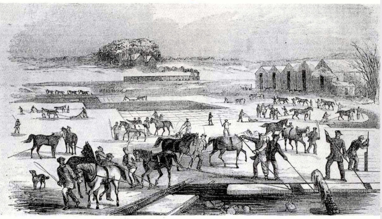 Workers cutting big blocks of ice from a frozen lake.