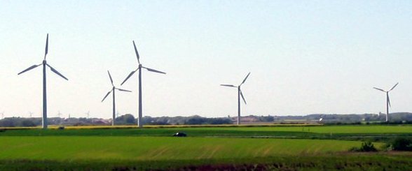 Tall wind turbines spinning in the breeze.