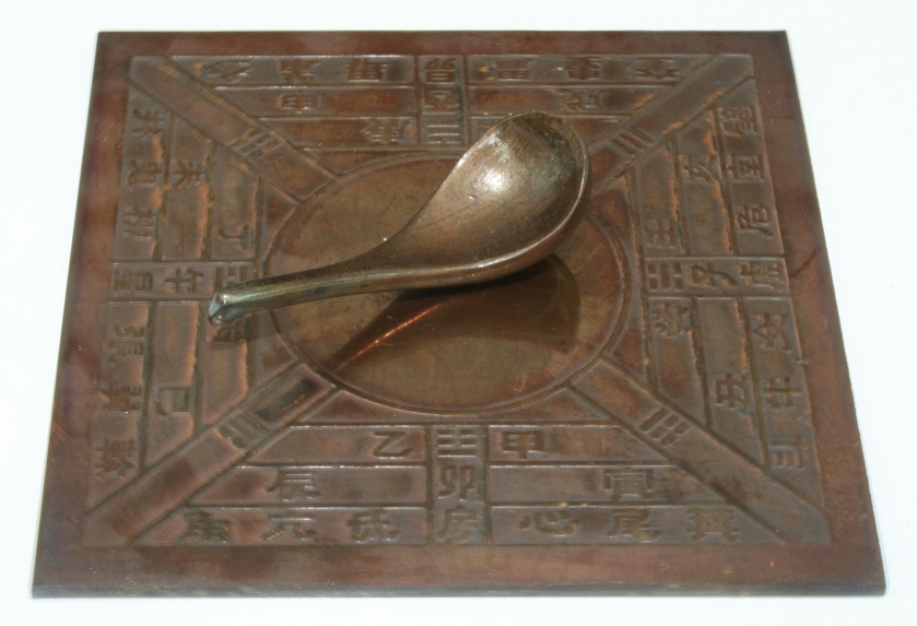 An ancient Chinese compass shaped like a little spoon.