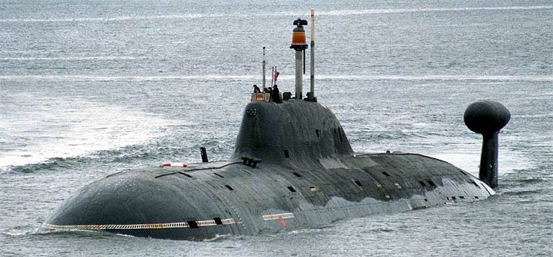 A big submarine floating on the ocean's surface.