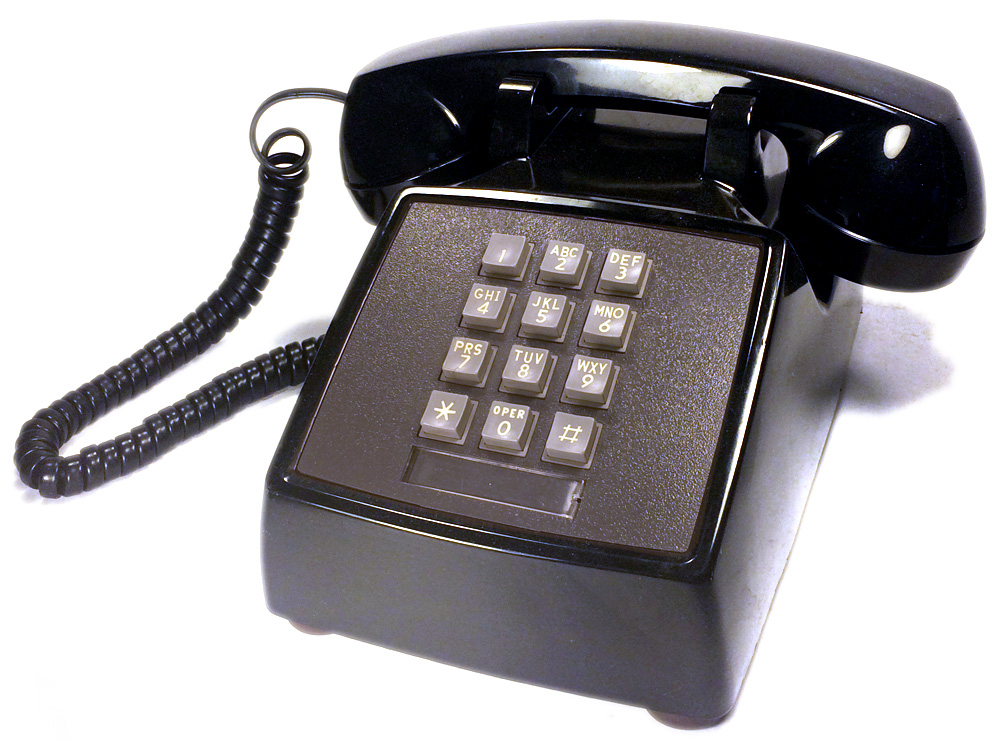 A classic black phone with number buttons to press.
