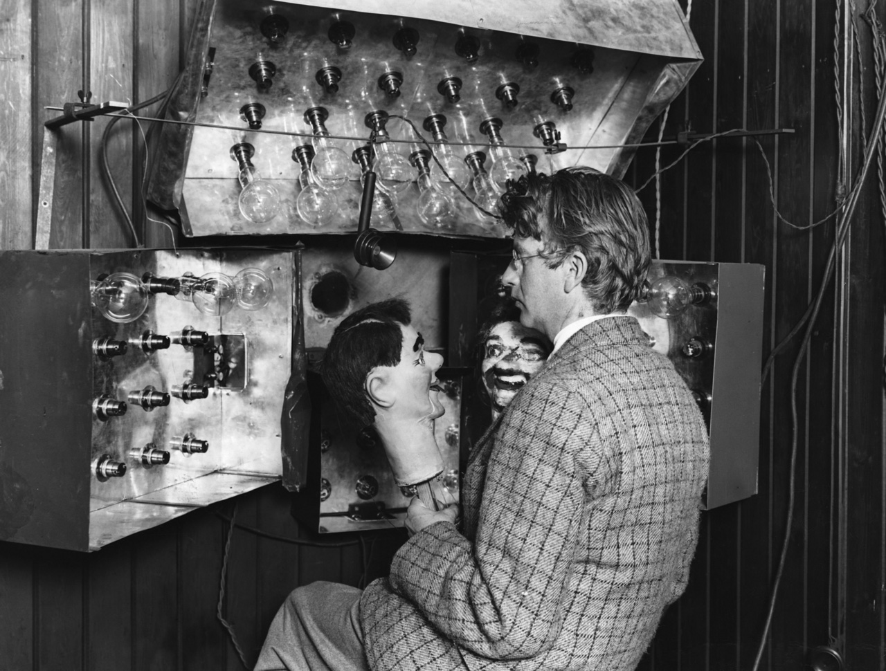 An inventor shows off one of the very first TV machines.