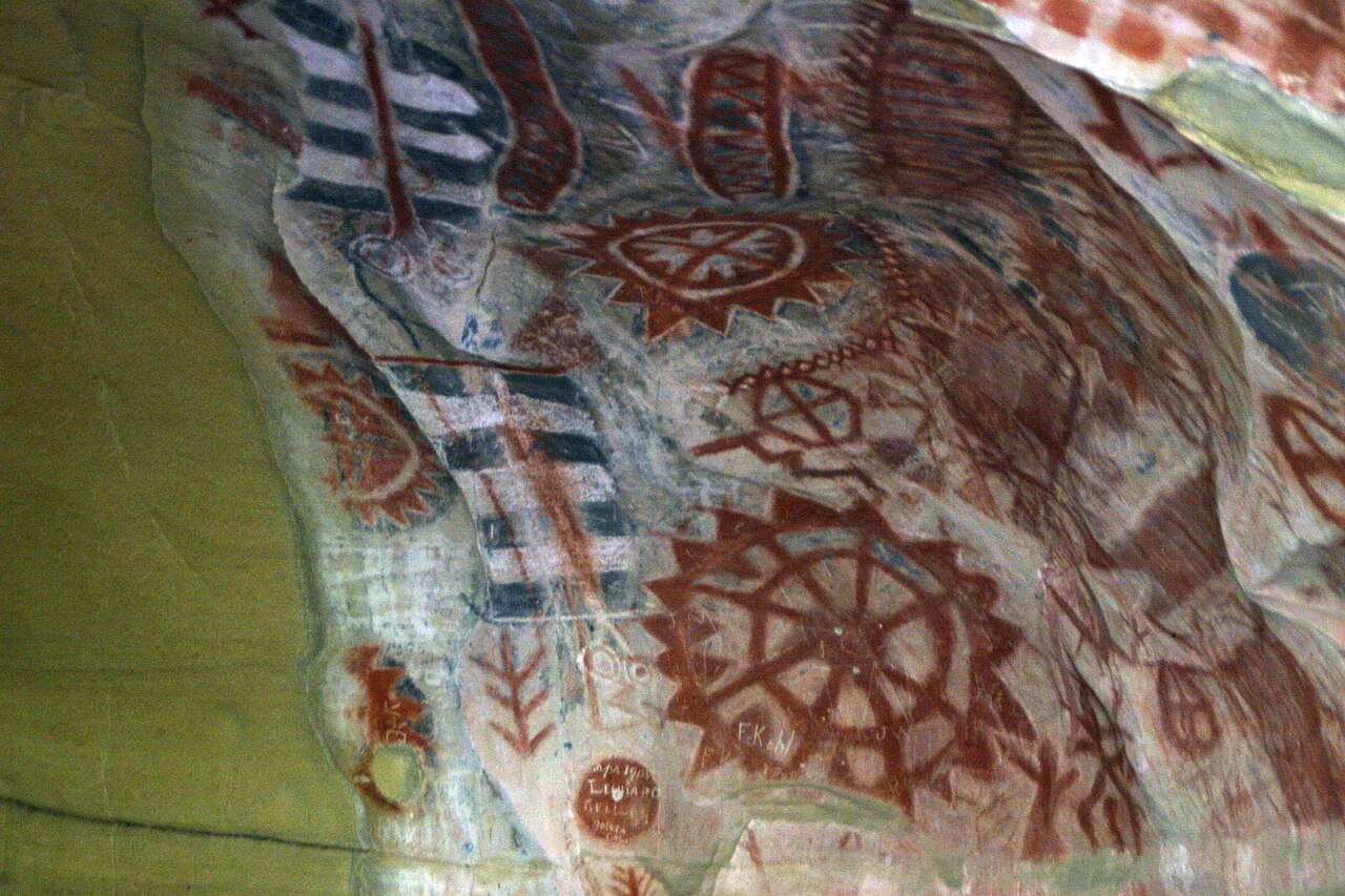 Old cave paintings show circle shapes drawn long ago.