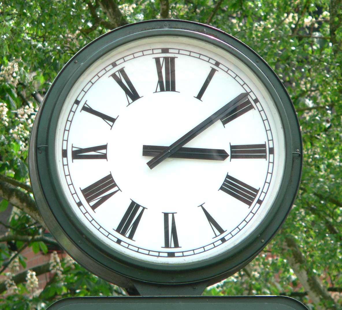 A clock in Germany with Roman numerals showing the hours.