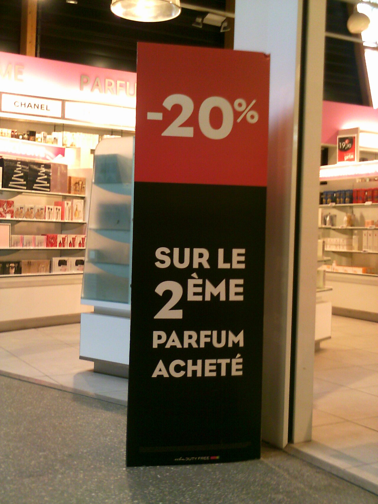 A shop sign shows prices being taken away in a sale.