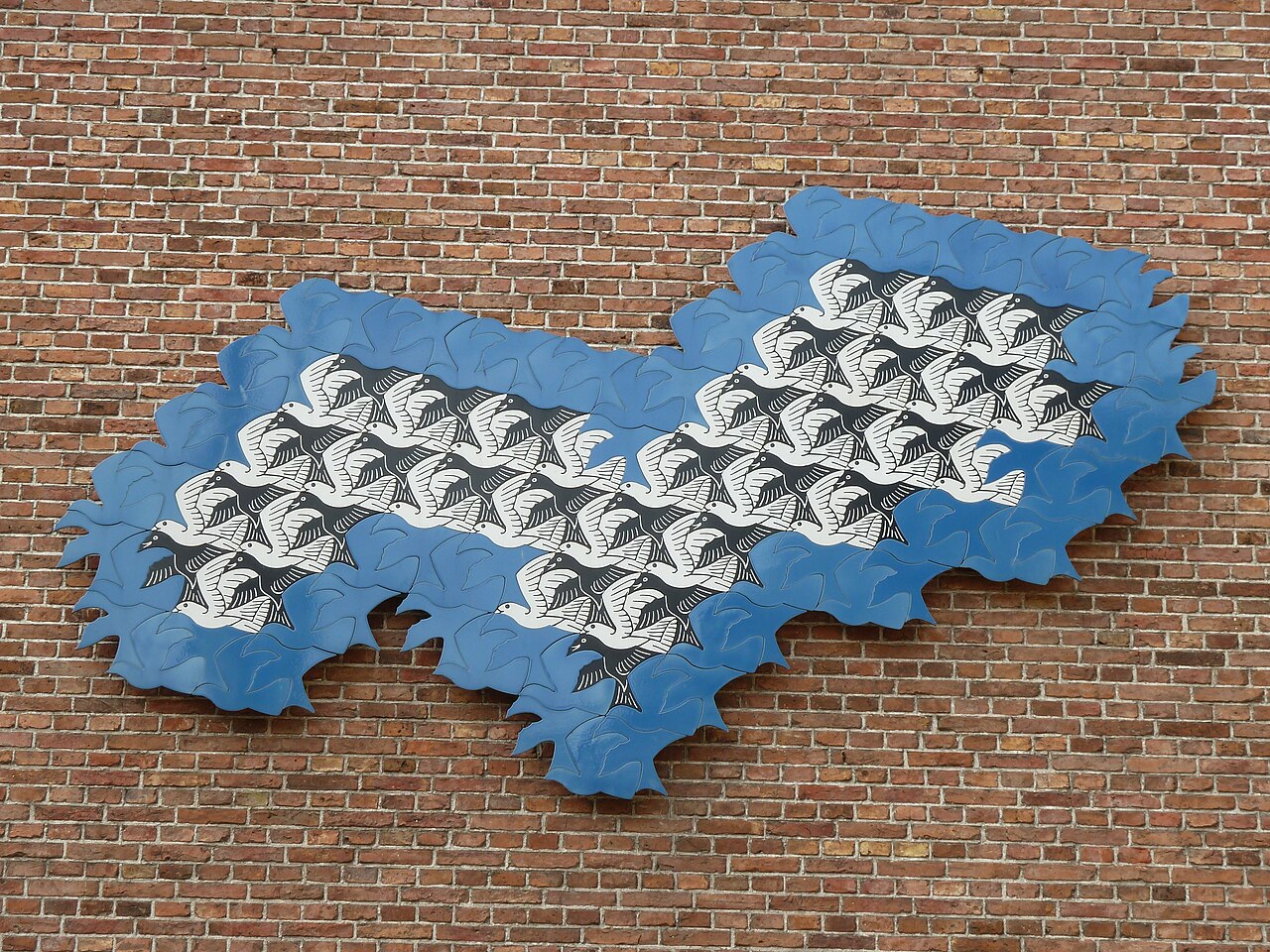 A wall art tessellation by the famous artist M. C. Escher.