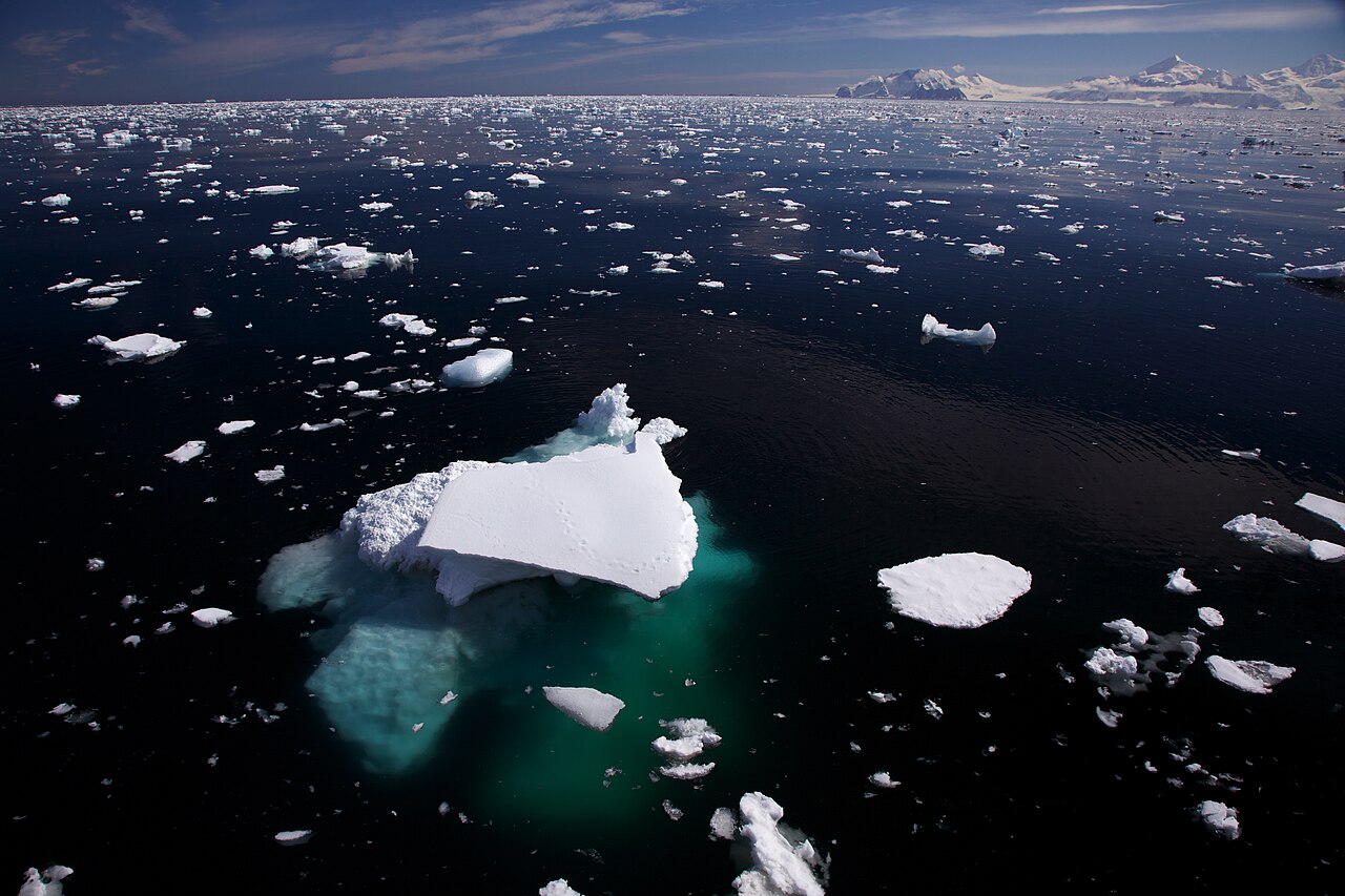 A big iceberg with most of its ice hidden below the water.
