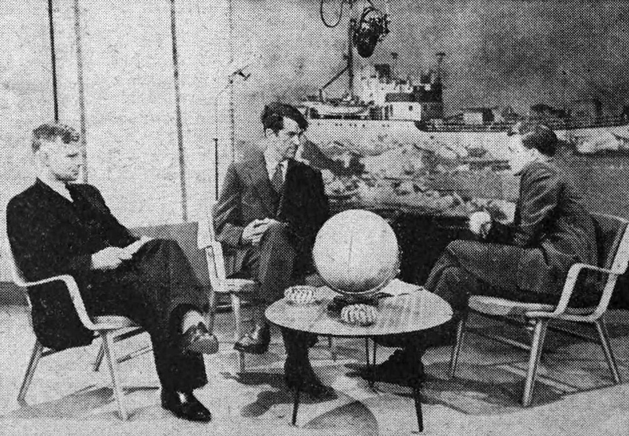 A young David Attenborough interviewing two famous explorers.