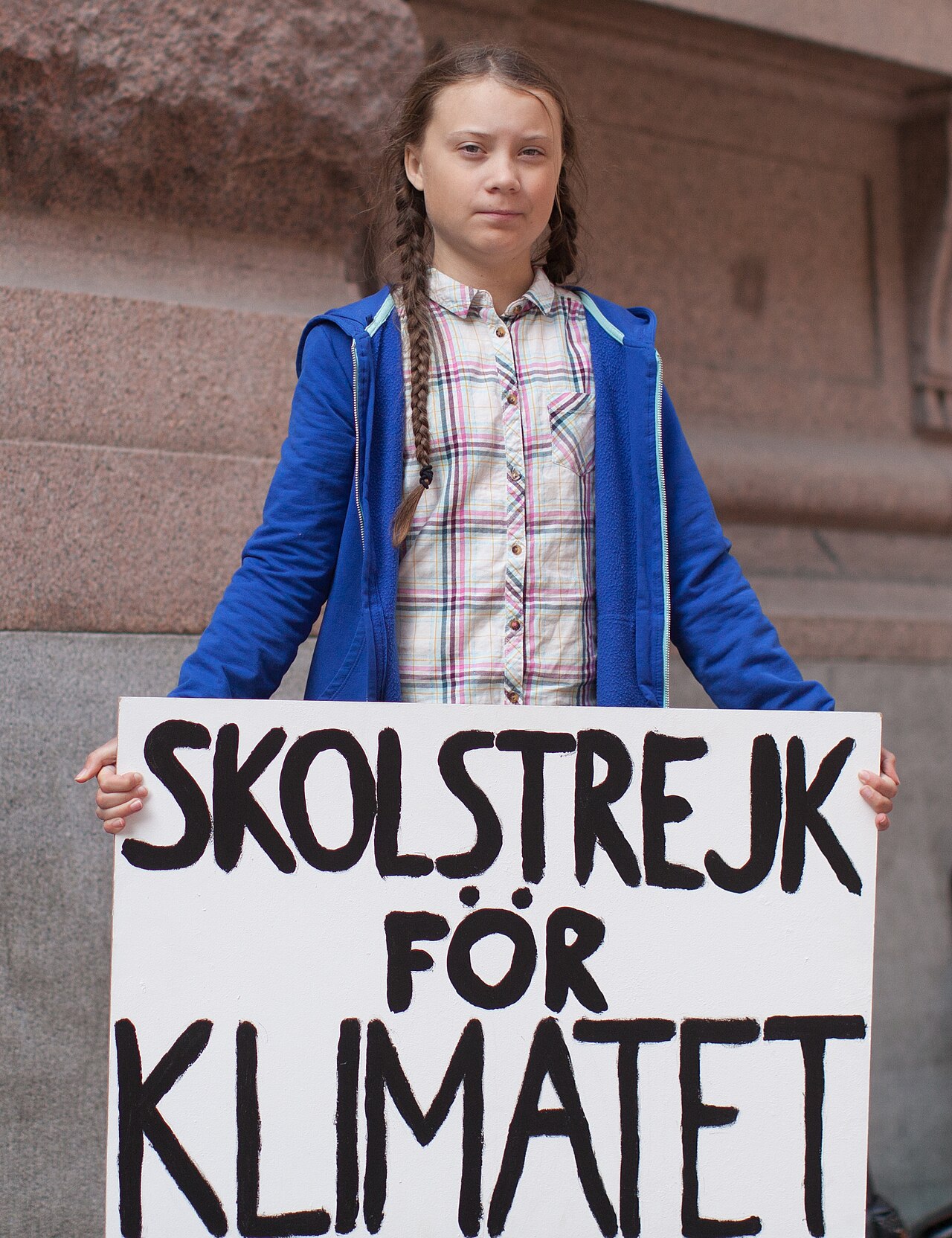 Greta Thunberg holds her famous school strike for climate sign.