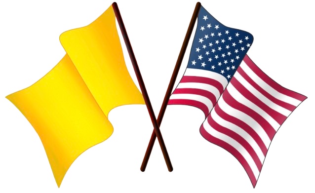A gold flag waves beside the American flag in the breeze.