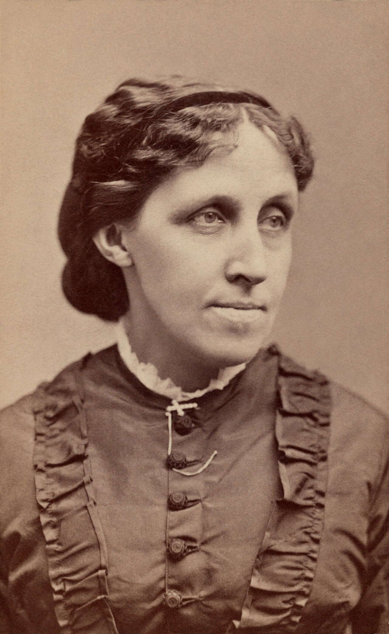 A studio photograph of the writer Louisa May Alcott.