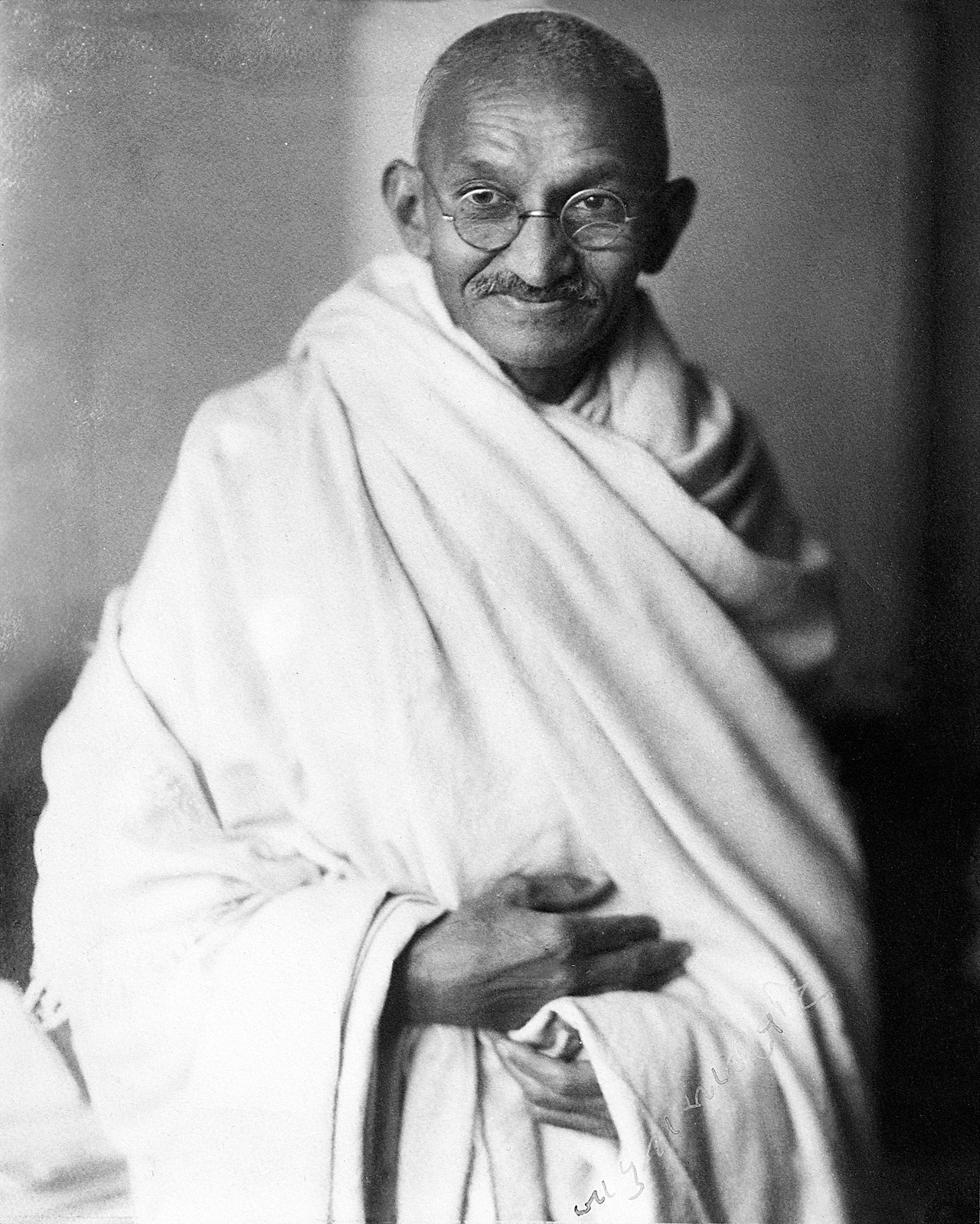 A studio photograph of Mahatma Gandhi taken in London in 1931.