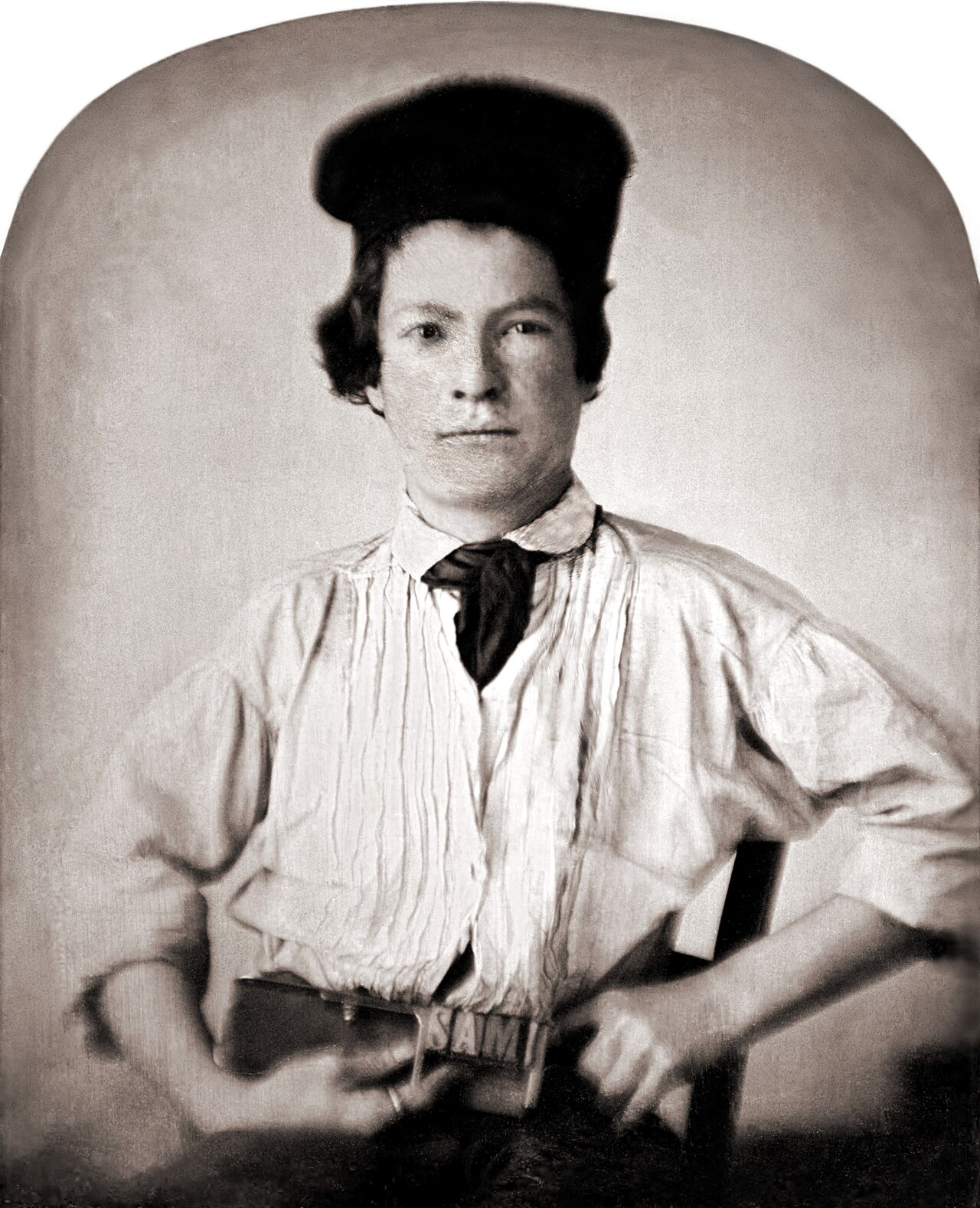 A young Mark Twain at age fifteen, holding a printing tool.