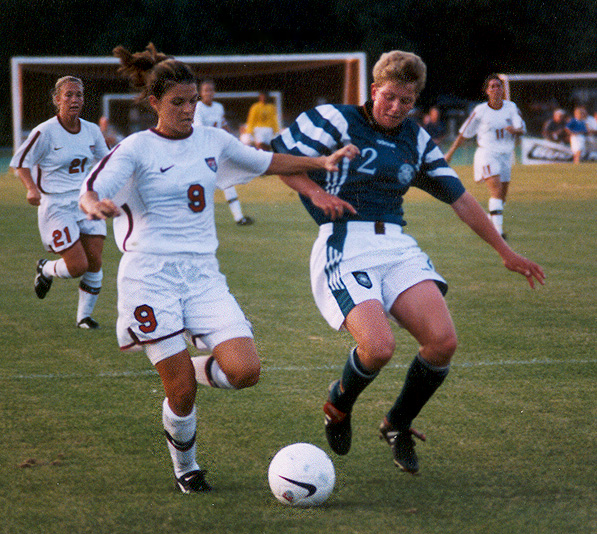 Mia Hamm playing soccer against Germany in 1997.