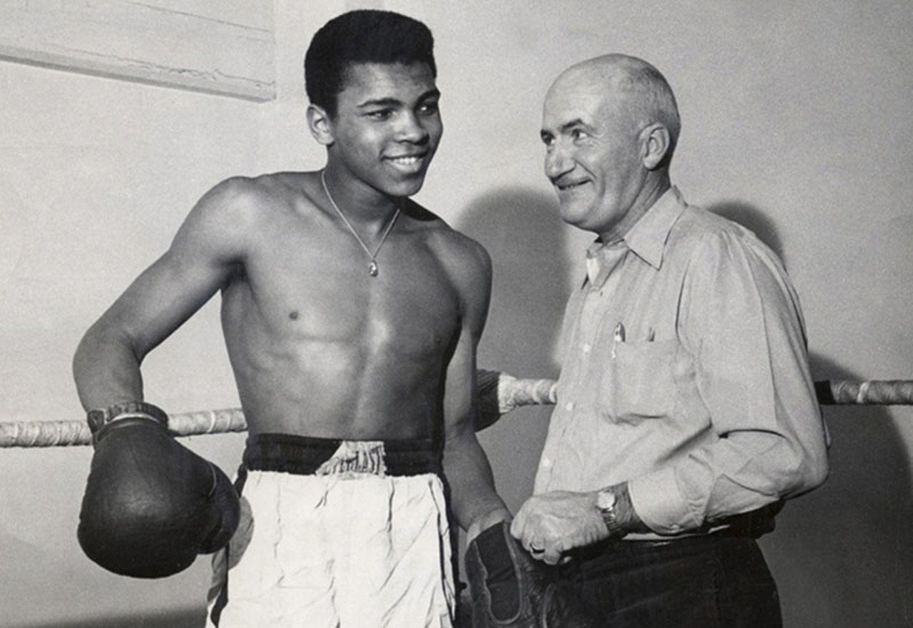 Young Muhammad Ali with his first boxing trainer.