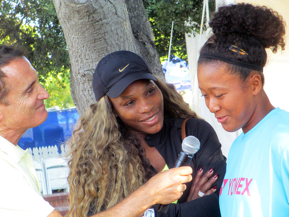 A young Naomi Osaka being interviewed with Serena Williams.
