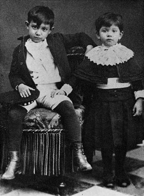 A young Pablo Picasso posing with his sister Lola.