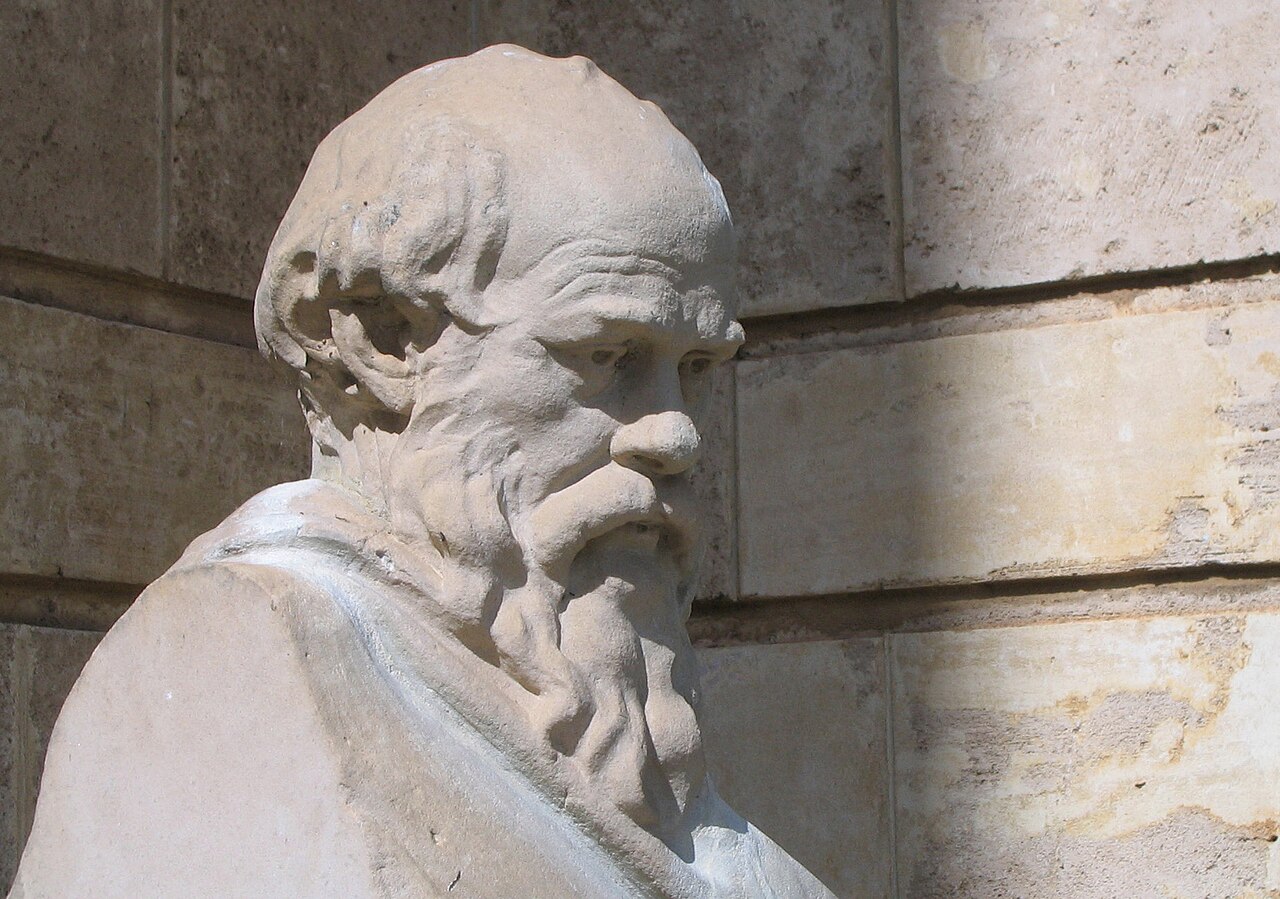 A carved stone head showing the ancient thinker Socrates.