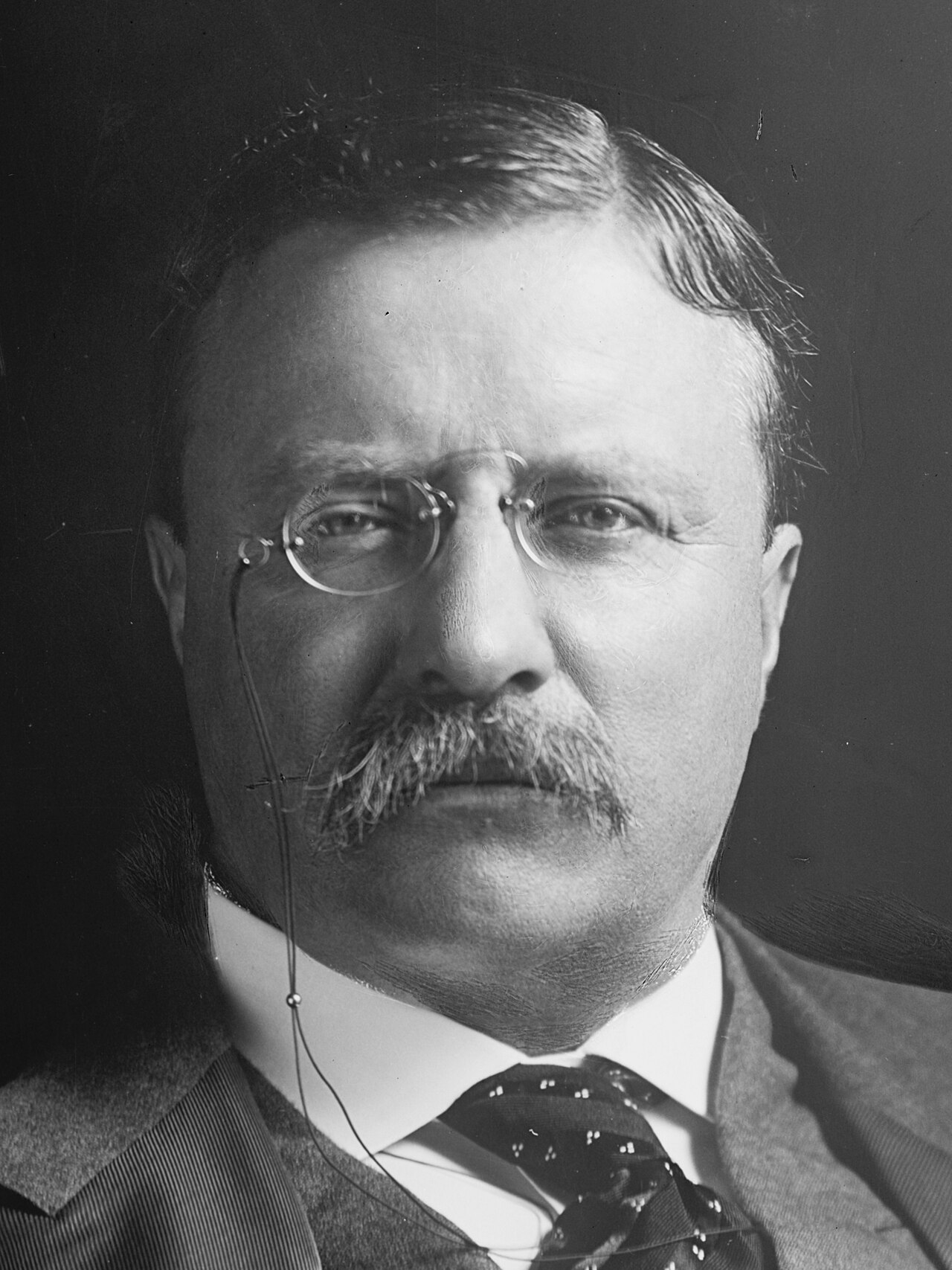 An old glass photograph of President Theodore Roosevelt.