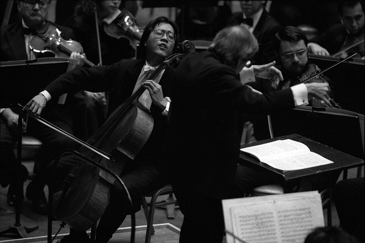 Cellist Yo-Yo Ma performing with a big orchestra in Los Angeles.