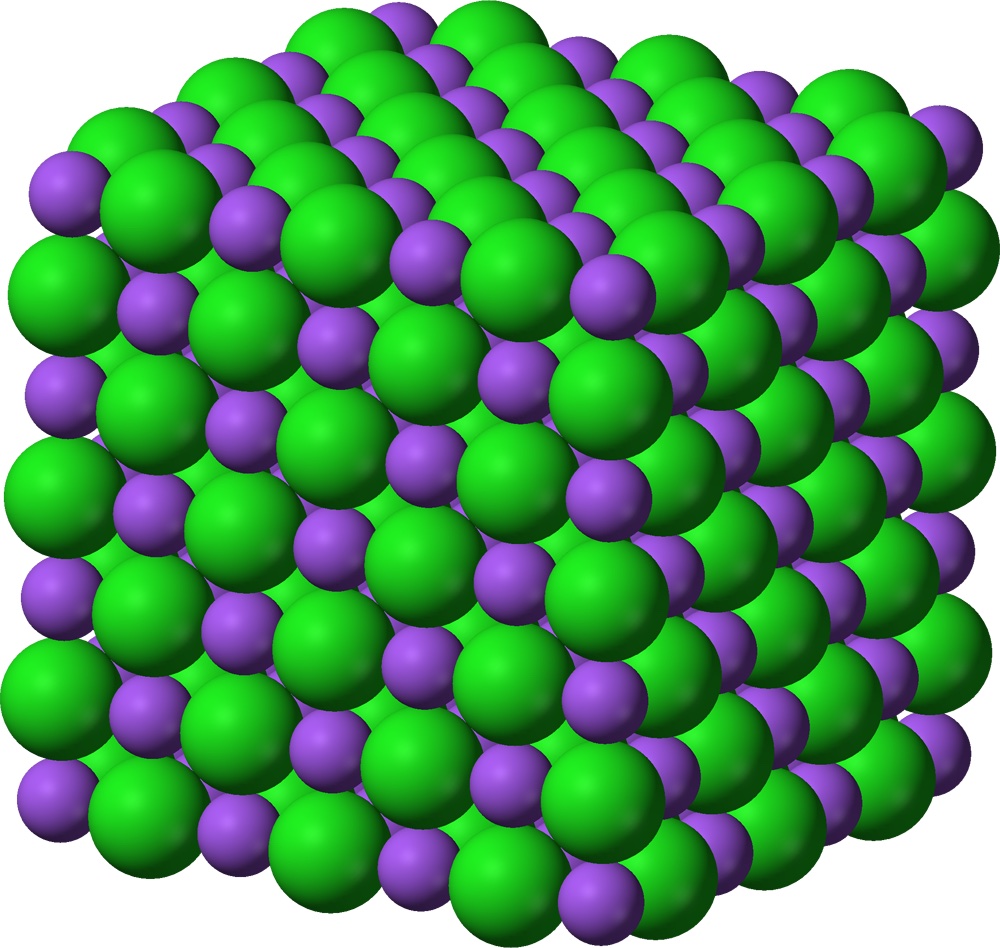 A model of salt showing tiny balls lined up in a neat pattern.