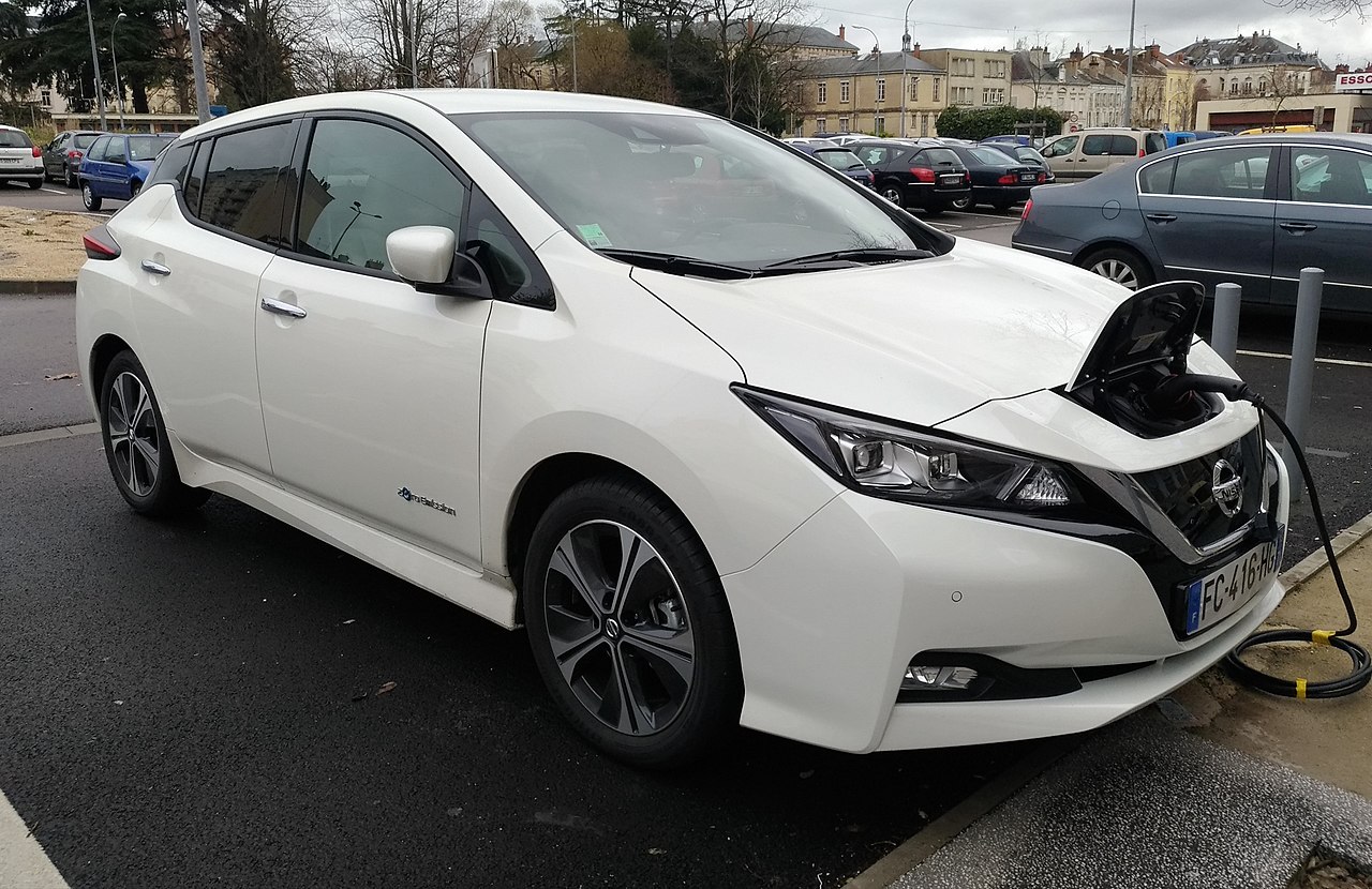 A shiny electric car that runs on battery power.