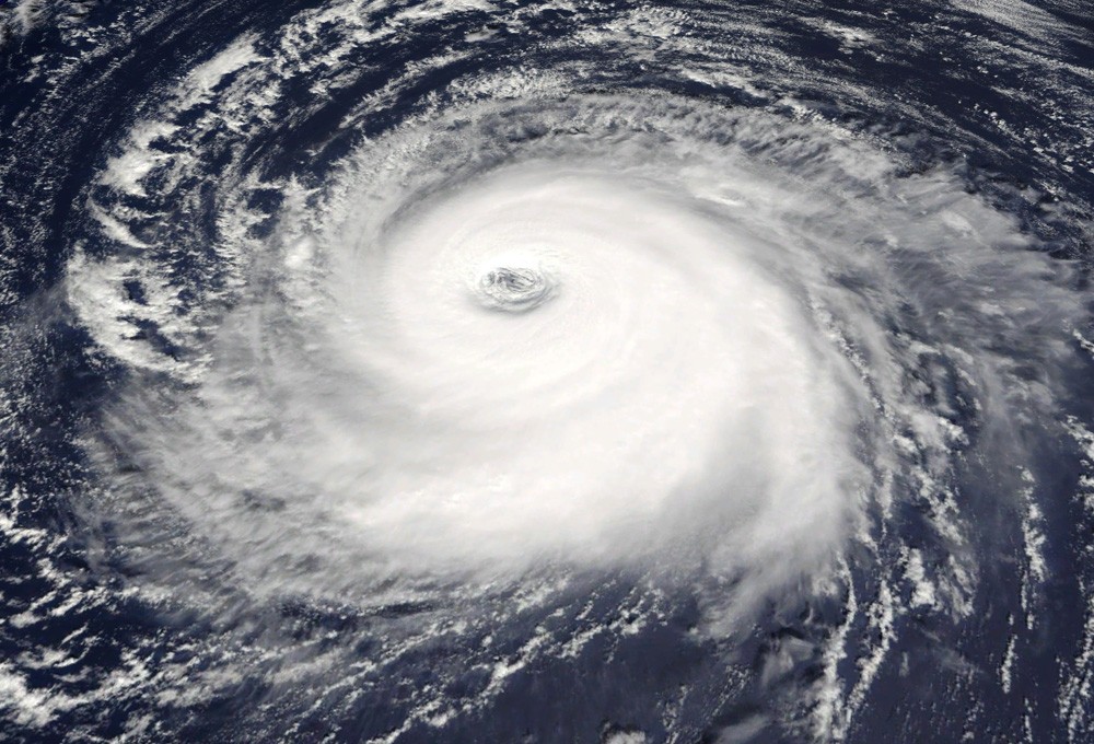 A satellite photo shows a huge hurricane swirling over the ocean.